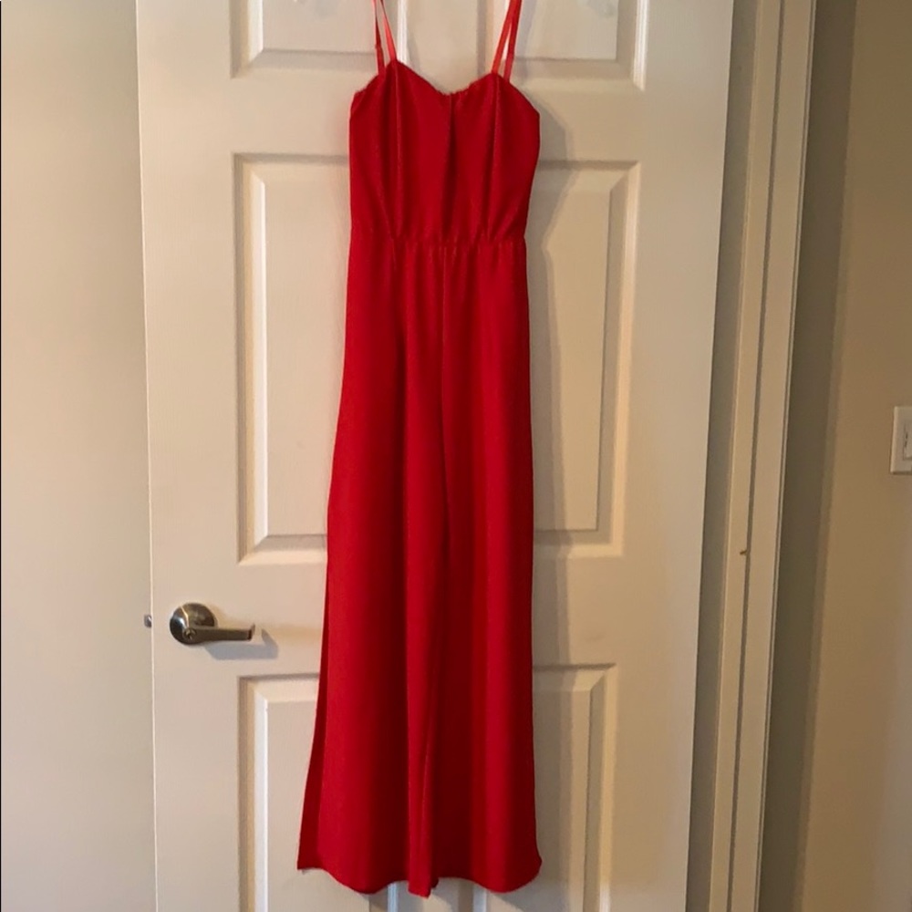 Red jumper w/ high leg slit detail
